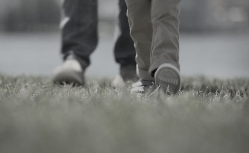 Feet walking through grass